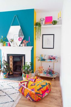 a brightly colored living room with a fireplace