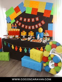 a lego themed birthday party with cake and decorations