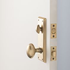 an open door with two knobs on the front and back of each door handle