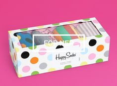 a box with polka dots on it that says for me happy socks in front of a pink background