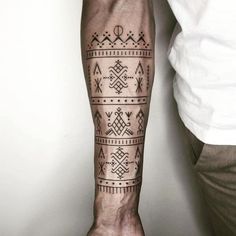 a man with a tattoo on his arm