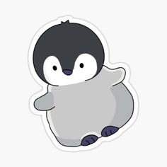 a penguin sticker sitting on top of a white surface next to a black and gray bird