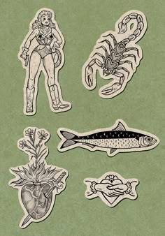 some stickers that are on top of a piece of paper with fish and other items