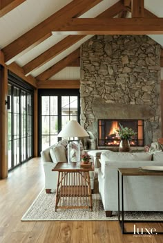 a living room filled with furniture and a fire place