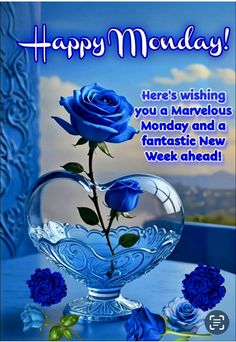 a blue rose is in a glass bowl on a table with the words happy monday here's wishing you a marvelous monday and a fantastic new week ahead