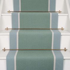 a set of stairs with blue and white carpet