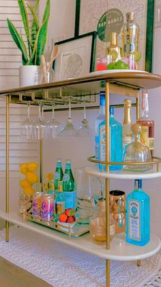 a bar cart filled with bottles and glasses