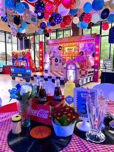 an image of a party setting with balloons and decorations on the ceiling for people to enjoy