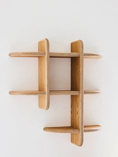 a wooden shelf with three shelves on it