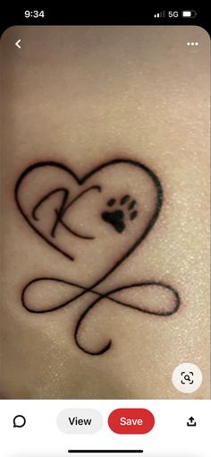 a small heart tattoo with a dog's paw in the shape of a heart