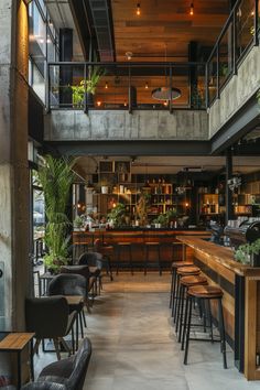 the interior of a restaurant with wooden tables and stools, potted plants on the wall