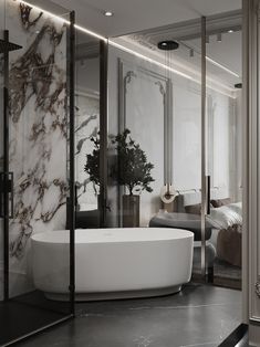 a bathtub in the middle of a room with marble walls and flooring on both sides