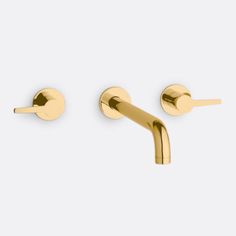 two gold - plated metal hooks on a white background, one is closed and the other has no handles