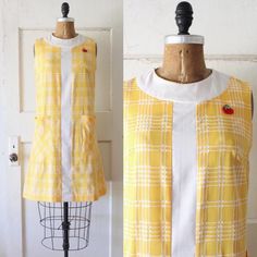 Adorable vintage 1960s golden yellow and white plaid shift dress with a cute little apple appliqué at the left shoulder. Made of a soft cotton nylon blend. Featuring a rounded white collar, white strip panel down the front, two large side pockets, and a plastic back zipper. Since this is a shift dress, please allow some room with the measurements as this is meant to fit loosely. ☾ Info ☽ Material: feels like cotton, possible a cotton nylon blend Label: Apple Lounger by I.Appel Condition: very good vintage condition Freshly laundered and ready to wear! ☾ Measurements ☽ Fits like: small Bust: 34" resting up to 37" pulled  Waist: 34" (your waist should be much smaller) Hips: 40" Length (from collar): 36.5" Armscythe (shoulder seam to underarm seam): 7 1/4" *shown unpinned on a 33" bust, 25" w Mod Shift Dress, Smaller Hips, Robes Vintage, 60s And 70s Fashion, Mary Quant, Unique Sweaters, 60s Style, 60s Mod, Darling Dress