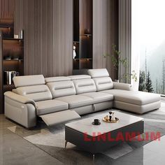 a modern living room with white leather furniture