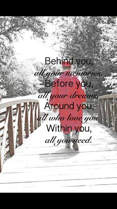 a person walking across a bridge with the words behind you, before you, and beyond you