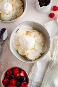 two bowls filled with ice cream and berries