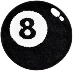 a black and white eight ball rug with the number eight in it's center