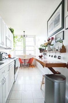 the kitchen is clean and ready to be used for cooking or dining, while also being used as an office