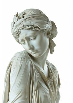 a statue of a woman with her eyes closed