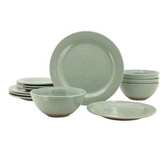 a set of green dishes and bowls on a white background