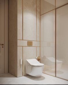 a white toilet sitting in the middle of a bathroom next to a walk in shower