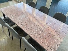 a long table with chairs around it in a room