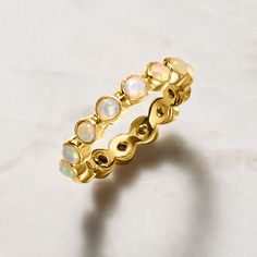 Ross-Simons - Opal Eternity Band Ring in 18kt Gold Over Sterling. Size 8. A lady can never have enough stackable rings! This colorful, mesmerizing eternity style features 3mm opal cabochons on a polished 18kt yellow gold over sterling silver band. It will look fabulous alone or with other favorites. 1/4" wide. Opal eternity band. Opal birthstones are the perfect gift for October birthdays. Yellow Gold Stackable Opal Ring For Promise, Dainty Yellow Gold Stackable Opal Ring, 14k Gold Stackable Opal Ring, 14k Gold Stackable Opal Ring With Round Band, Stackable Opal Ring In 14k Gold With Round Band, Stackable Yellow Gold Opal Ring For Anniversary, Fine Jewelry Stackable Opal Ring With Round Band, Stackable Opal Ring In Yellow Gold For Anniversary, Stackable Opal Ring