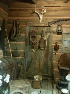 an old wooden room with various items on the wall