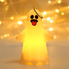 a small light up ghost with its tongue out