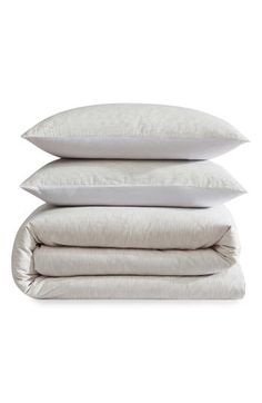 three pillows stacked on top of each other