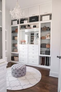 a white closet with lots of shoes and bags on the shelves in front of it