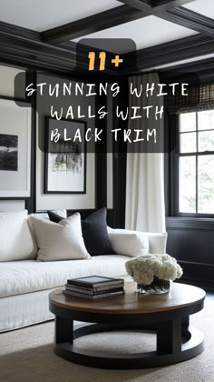 a living room with black trim and white walls