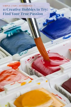 an artist's palette with paint and brush in it