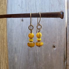 I have been seeing mustard yellow all over lately. I have had these beads tucked away, just waiting for inspiration. These earrings are dangling from pure titanium post ear wire. Perfect for those with sensitive ears. The Czech bead is a 6mm melon bead. It has a touch of black in various places on the bead. Very vintage feel to the beads. These earrings are a perfect match to the necklace that is also listed. You can find it here. https://www.etsy.com/listing/707647612/vintage-style-mustard-yell Yellow Beaded Czech Glass Earrings, Yellow Beaded Earrings With Czech Glass, Yellow Beaded Earrings In Czech Glass, Hypoallergenic Gold Bohemian Beaded Earrings, Nickel-free Yellow Czech Glass Earrings, Nickel Free Yellow Czech Glass Earrings, Yellow Beaded Earrings For Pierced Ears As Gift, Yellow Czech Glass Beaded Dangle Earrings, Adjustable Yellow Beaded Earrings