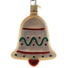 a glass ornament with a bell on it's side and a red bottom