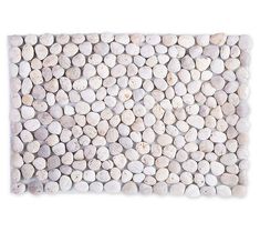 a white tile with pebbles on it