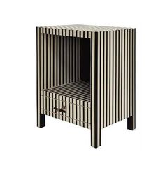 a black and white striped side table with one drawer open on the bottom, two drawers closed at the top