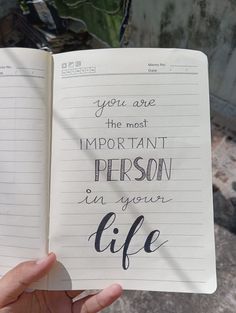 someone is holding an open notebook with writing on the pages that read, you are the most important person in your life