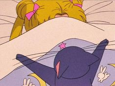 a cartoon character laying on top of a bed