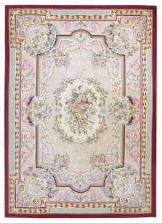 a rug with an ornate design on the center and sides, in pink, green, yellow and red colors