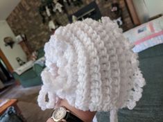 I love making these baby bonnets...  reminds me of the days long ago...    These bonnets never go out of style...and they make such a thoughtful baby gift...perfect gift for baby coming home for the first time... and it will go with any color.  never doubles.  It is a generous size   and white is perfect for any outfit.  any sno suit...any dress.  Such a thoughtful gift. Cute Fitted White Bonnet, Cute White Fitted Bonnet, Cute White Baptism Hat, Handmade Yarn Bonnet As A Gift, Handmade Yarn Bonnet As Gift, Cute White Knitted Bonnet, White Crochet Hat For Winter Gift, Winter White Crochet Hat As Gift, White Fitted Crochet Hat