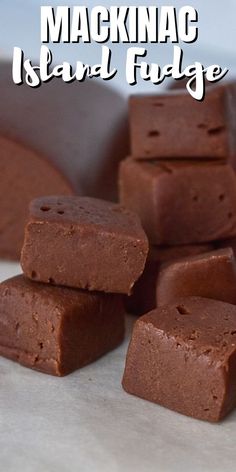 chocolate fudges stacked on top of each other in front of the words, macknacc island fudge