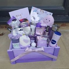 a purple box filled with lots of items on top of a cement floor next to a door