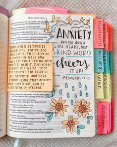 an open bible with colorful markers on it and the word,'annity which doesn '