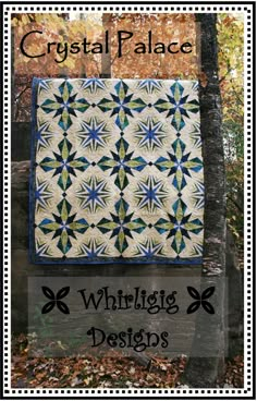 a quilted wall hanging in the woods with text that reads crystal palace whirling designs