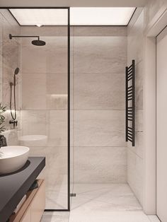 a bathroom with two sinks and a glass shower stall in the middle of the room