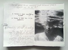 an open notebook with writing on it and a photo of a man in the water