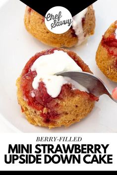 mini strawberry upside down cake on a white plate with a hand holding a knife over it