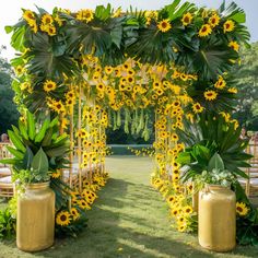 an outdoor ceremony with sunflowers and greenery